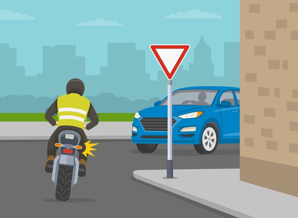 Illustration showing safe car driving tips and traffic regulation rules, with a motorcycle turning right at a sharp turn near a 'give way' sign. A potential accident with an oncoming vehicle is depicted.